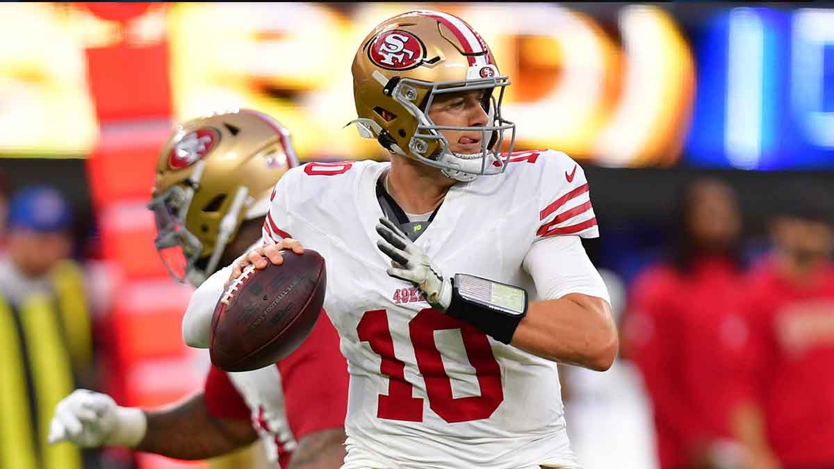 San Francisco 49ers quarterback Mac Jones (10) drops back to pass against the Los Angeles Rams during the first half at SoFi Stadium.