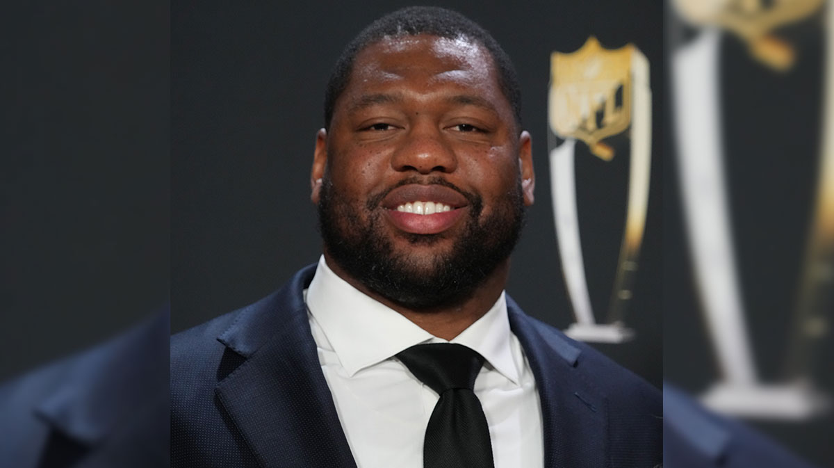 Feb 9, 2023; Phoenix, Arizona, US; Washing Commanders tackle Charles Leno, Jr. poses for a photo on the red carpet before the NFL Honors award show at Symphony Hall. Mandatory Credit: Kirby Lee-Imagn Images