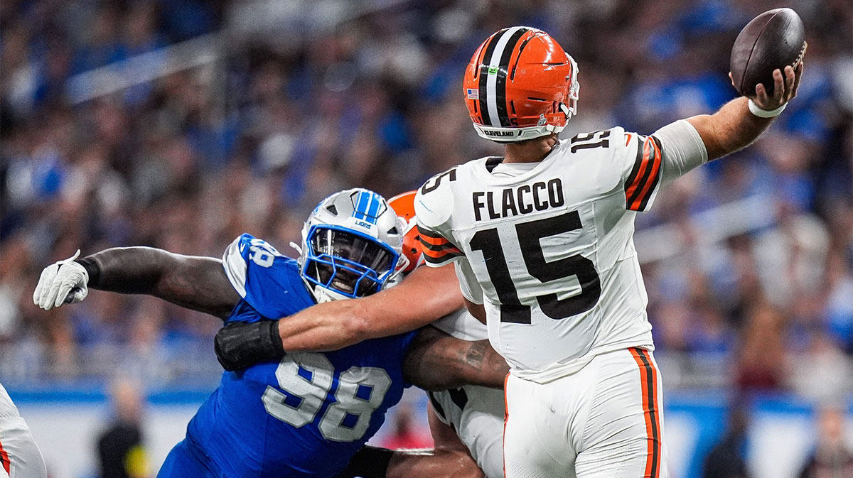 Detroit Lions defensive tackle DJ Reader (98) tries to tackle Cleveland Browns quarterback Joe Flacco (15) during the second half at Ford Field in Detroit on Sunday, Sept. 28, 2025.