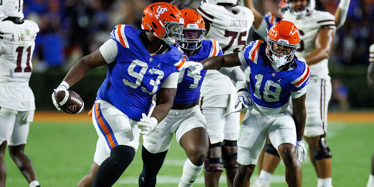 Florida Gators defensive tackle Michai Boireau (93) celebrates with safety Bryce Thornton (18) after an interception during the second half at Ben Hill Griffin Stadium.