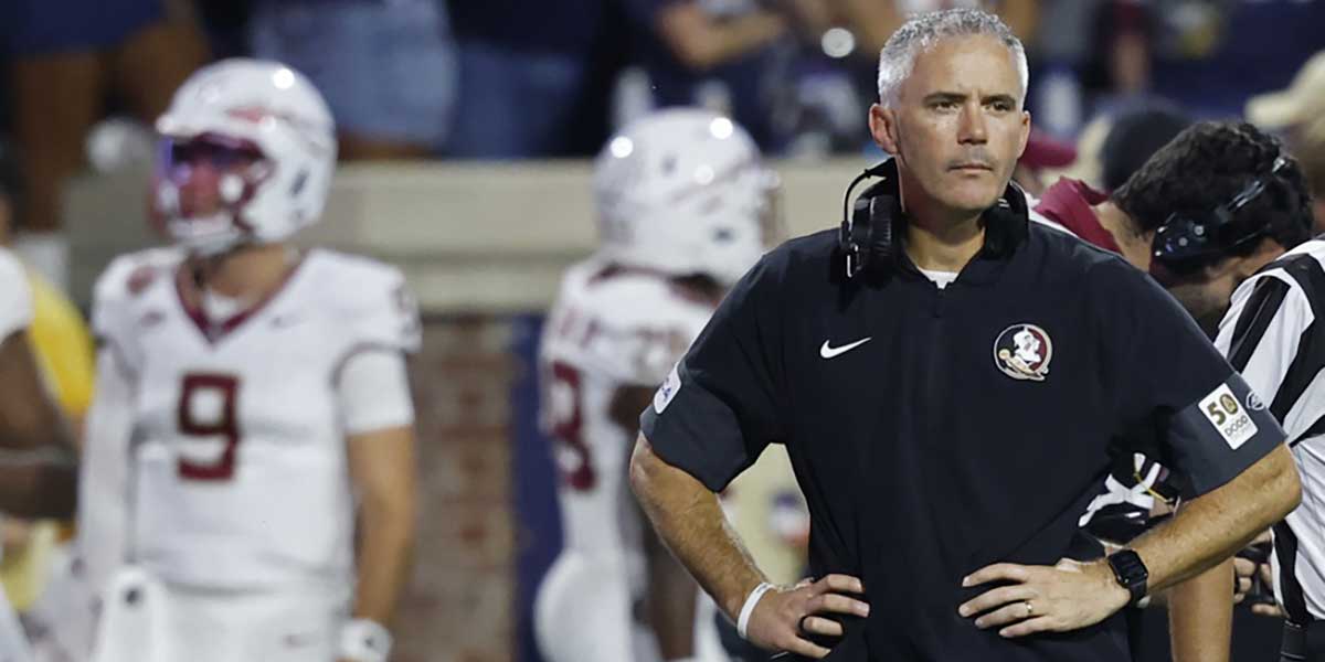 Charlottesville, Virginia, USA; Florida State Seminoles head coach Mike Norvell looks on during a stoppage in play against the Virginia Cavaliers at Scott Stadium. Mandatory Credit: Geoff Burke-Imagn Images