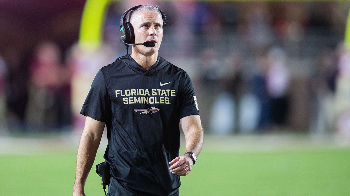 Florida State Seminoles head coach Mike Norvell walks down the field.