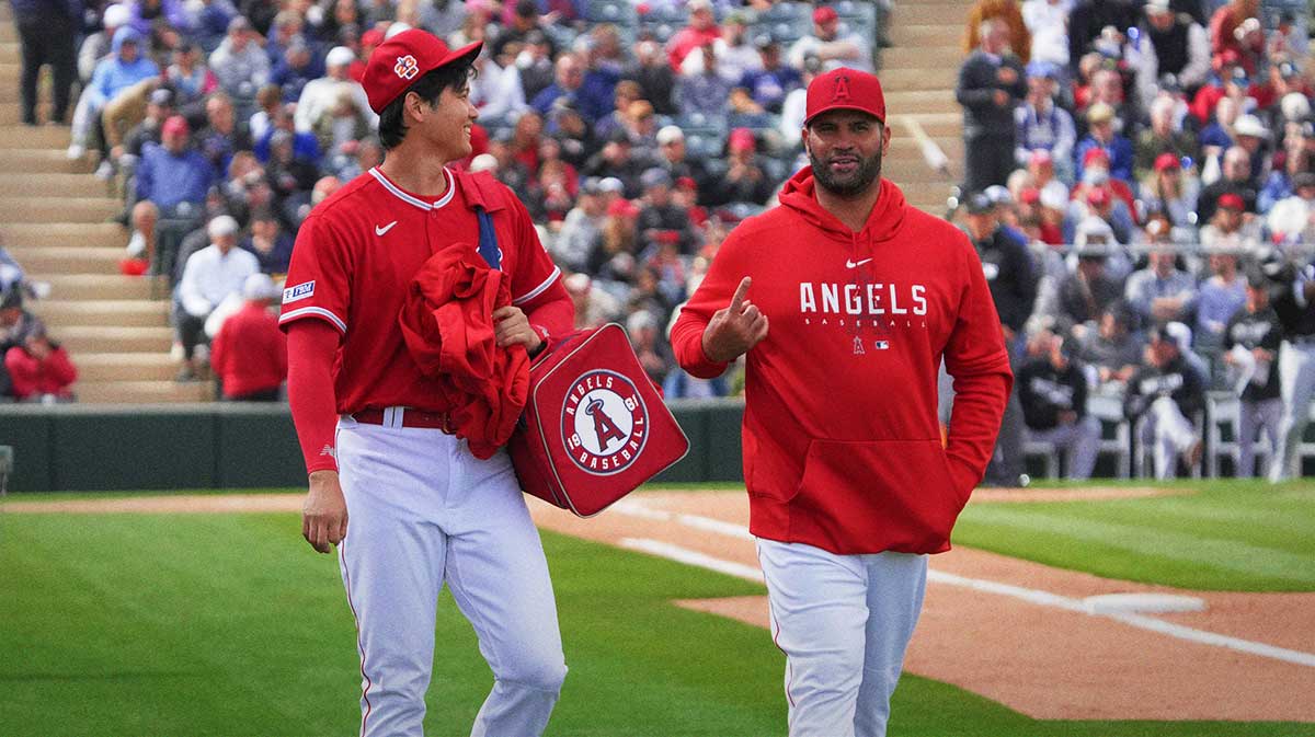 Los Angeles Angels starting pitcher Shohei Ohtani (17) and Albert Pujols leave the game together in the fourth inning against the Chicago White Soxat Tempe Diablo Stadium.