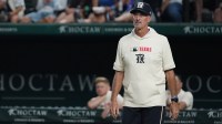 Texas Rangers pitching coach Mike Maddux (31) walks to the mound to visit with the pitcher during the seventh inning against the Cleveland Guardians at Globe Life Field.