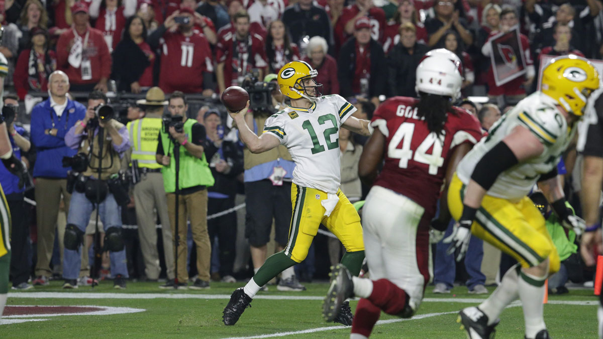 Green Bay Packers quarterback Aaron Rodgers launches a hail-Mary pass during the final seconds of their divisional playoff game on June 16, 2016, at the the University of Phoenix Stadium in Glendale, Arizona. The Arizona Cardinals beat the Green Bay Packers in overtime 26-20.