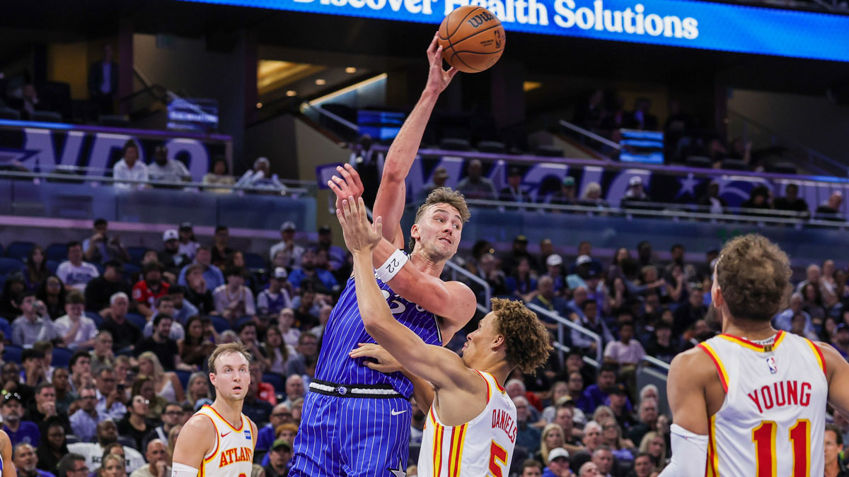 Orlando Magic forward Franz Wagner (22) passes the ball over Atlanta Hawks guard Dyson Daniels (5) during the second half at Kia Center.