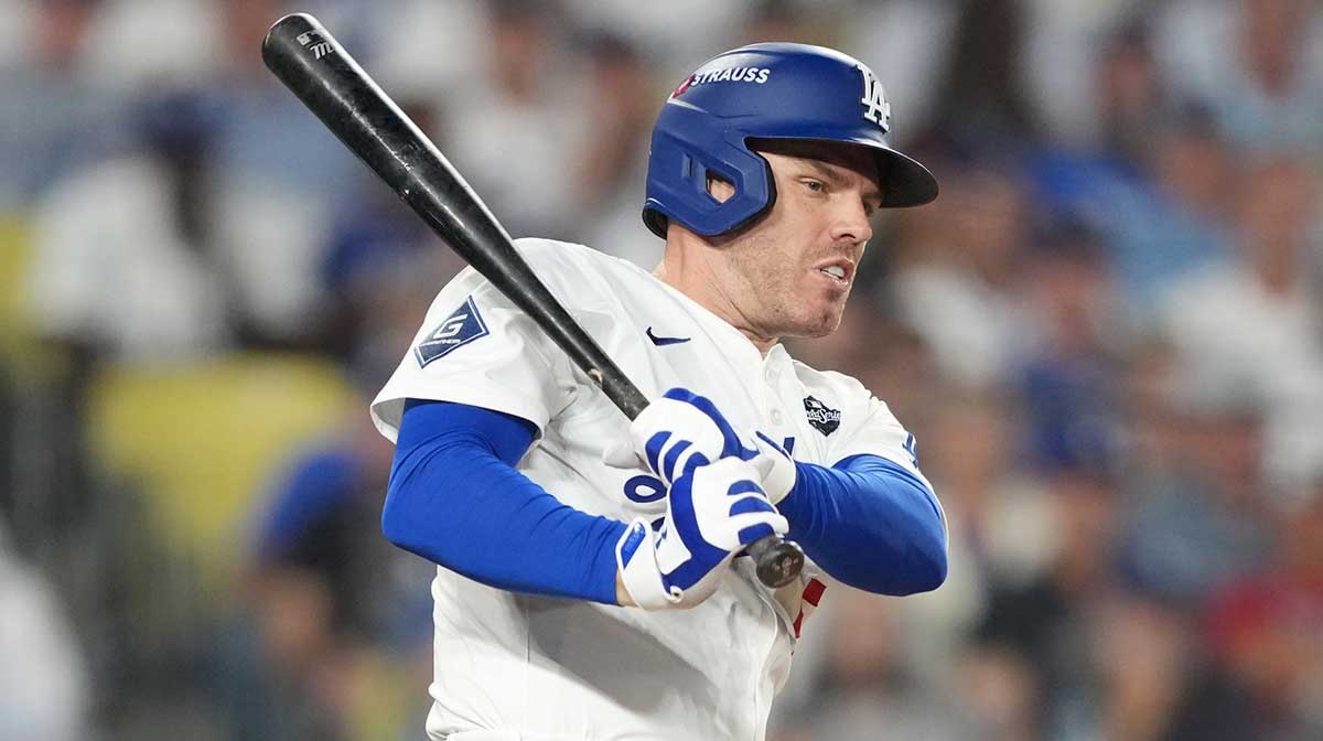 Los Angeles Dodgers first baseman Freddie Freeman (5) hits a single against the Toronto Blue Jays in the sixth inning during game four of the 2025 MLB World Series at Dodger Stadium.