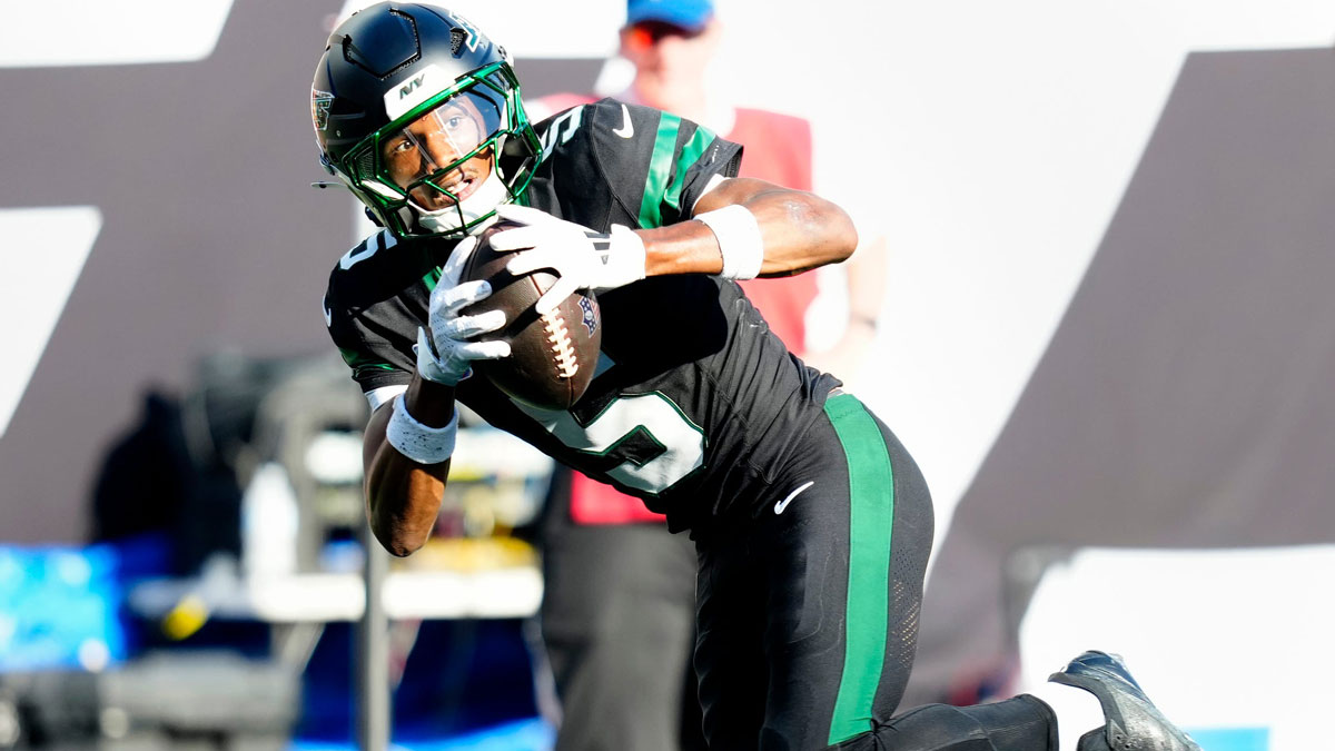 New York Jets wide receiver Garrett Wilson (5) completes a pass which he ran in for a touchdown, Sunday, October 5, 2025.