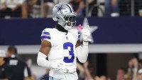 Dallas Cowboys wide receiver George Pickens (3) celebrates after scoring a touchdown in the fourth quarter against the Green Bay Packers at AT&T Stadium.