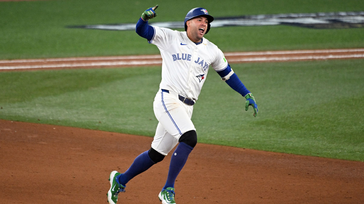 Toronto Blue Jays right fielder George Springer (4) celebrates as he runs the bases after hitting a three run home run against the Seattle Mariners in the seventh inning during game seven of the ALCS round for the 2025 MLB playoffs at Rogers Centre.
