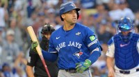 Toronto Blue Jays right fielder George Springer (4) reacts after striking out against the Los Angeles Dodgers in the first inning during game three of the 2025 MLB World Series at Dodger Stadium.