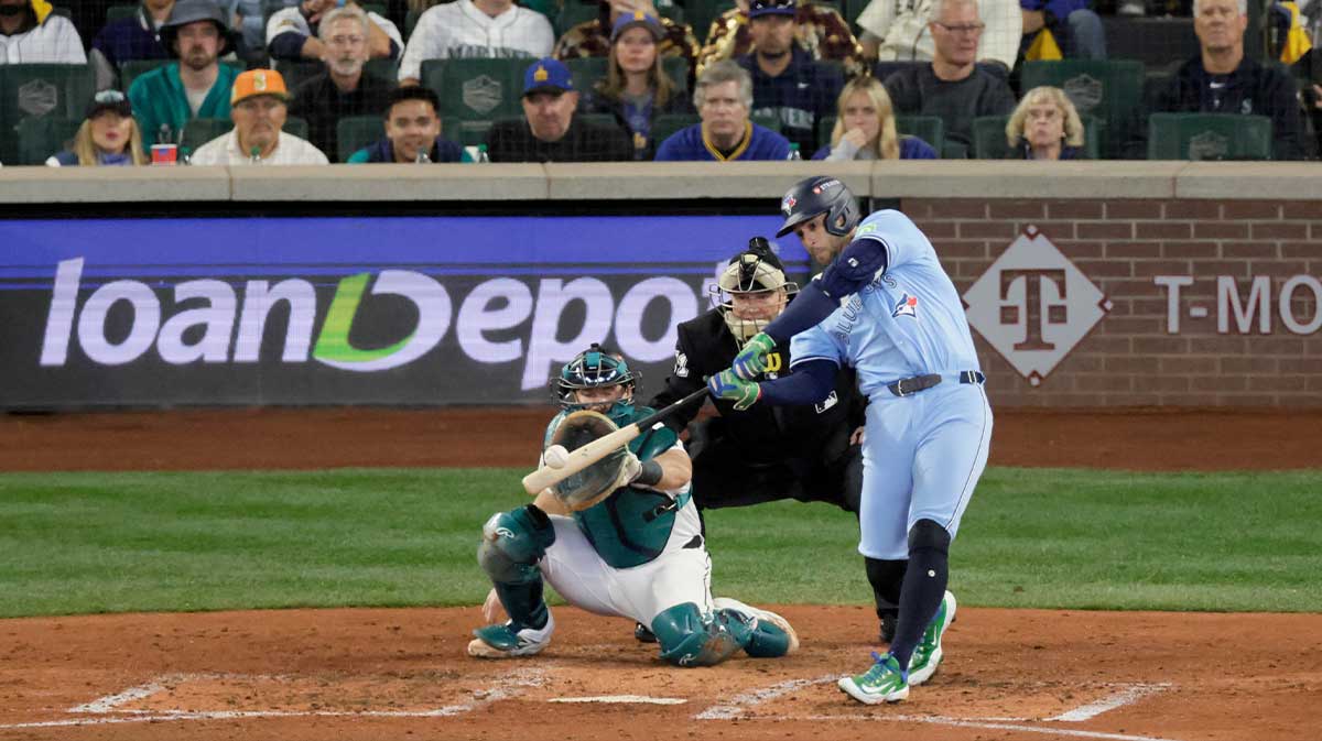 Oct 17, 2025; Seattle, Washington, USA; Toronto Blue Jays designated hitter George Springer (4) hits an RBI double against the Seattle Mariners in the fifth inning during game five of the ALCS round for the 2025 MLB playoffs at T-Mobile Park.
