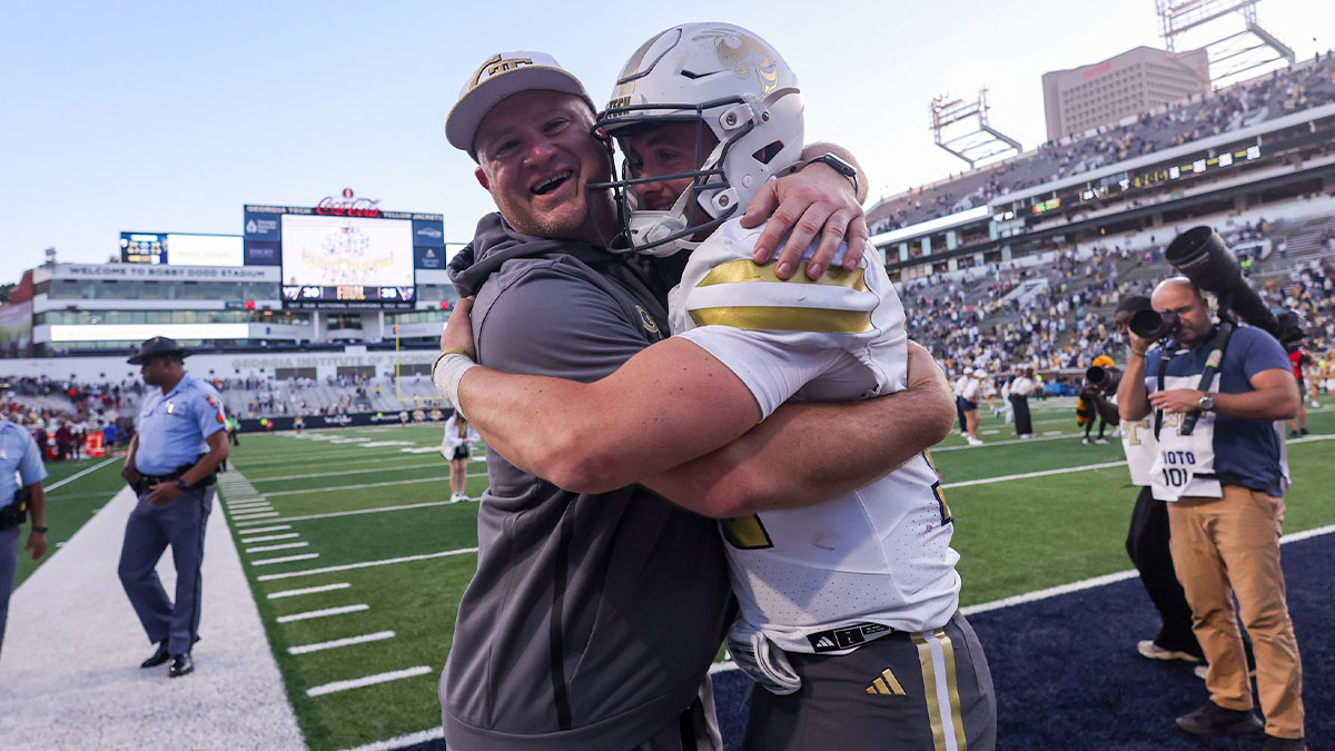 Georgia Tech Yellow Jackets head coach Brent Key and quarterback Haynes King (10) celebrate after a victory over the Virginia Tech Hokies at Bobby Dodd Stadium at Hyundai Field.