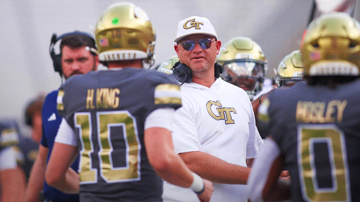 Georgia Tech Yellow Jackets head coach Brent Key celebrates with quarterback Haynes King (10) after a touchdown pass against the Temple Owls in the first quarter at Bobby Dodd Stadium at Hyundai Field.