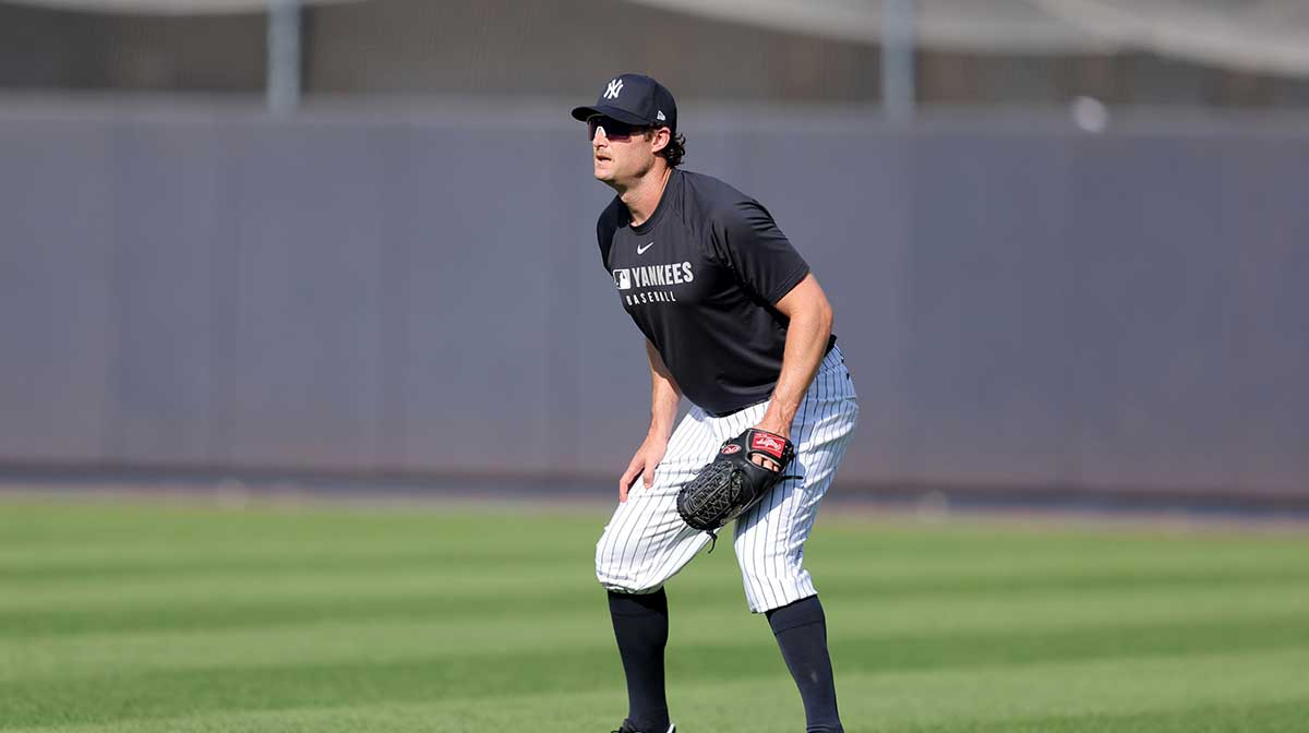 New York Yankees injured starting pitcher Gerrit Cole shags fly balls in the outfield during batting practice before a game against the Minnesota Twins at Yankee Stadium.