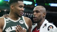 Milwaukee Bucks forward Giannis Antetokounmpo (34) and Washington Wizards forward Khris Middleton (22) former teammates talk to each other after their game at Fiserv Forum.