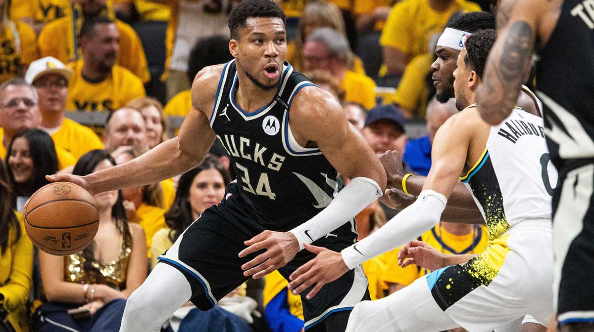 Milwaukee Bucks forward Giannis Antetokounmpo (34) dribbles the ball while Indiana Pacers forward Jarace Walker (5) defends during game five of the first round for the 2024 NBA Playoffs at Gainbridge Fieldhouse.