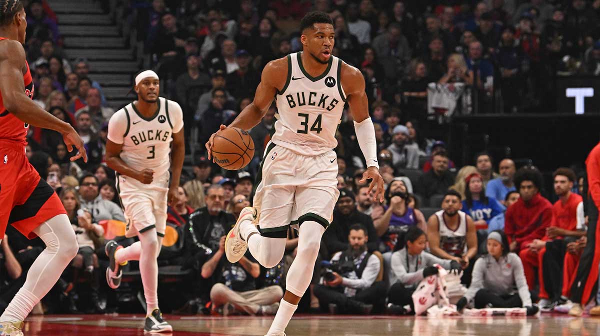 Milwaukee Bucks forward Giannis Antetokounmpo (34) dribbles against the Toronto Raptors in the first quarter at Scotiabank Arena.