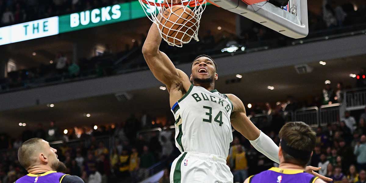 Milwaukee Bucks forward Giannis Antetokounmpo (34) dunks against the Los Angeles Lakers in the first quarter at Fiserv Forum. Mandatory Credit: Benny Sieu-Imagn Images