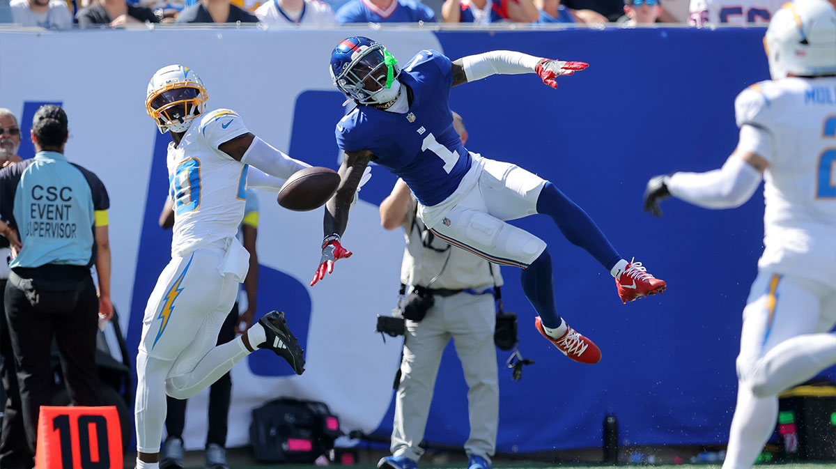 Los Angeles Chargers cornerback Cam Hart (20) breaks up a pass intended for New York Giants wide receiver Malik Nabers (1) during the second quarter at MetLife Stadium. Nabers was carted off the field with an injury after the play.