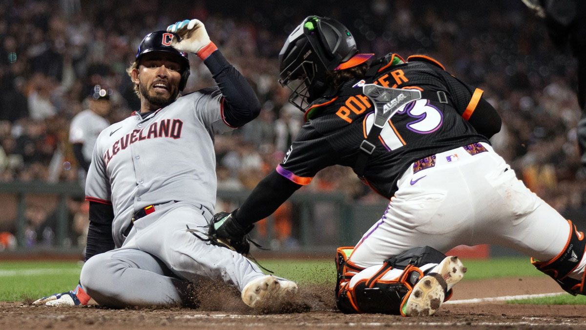 San Francisco Giants catcher Logan Porter (13) tags out Cleveland Guardians shortstop Gabriel Arias to complete a double play during the ninth inning at Oracle Park.