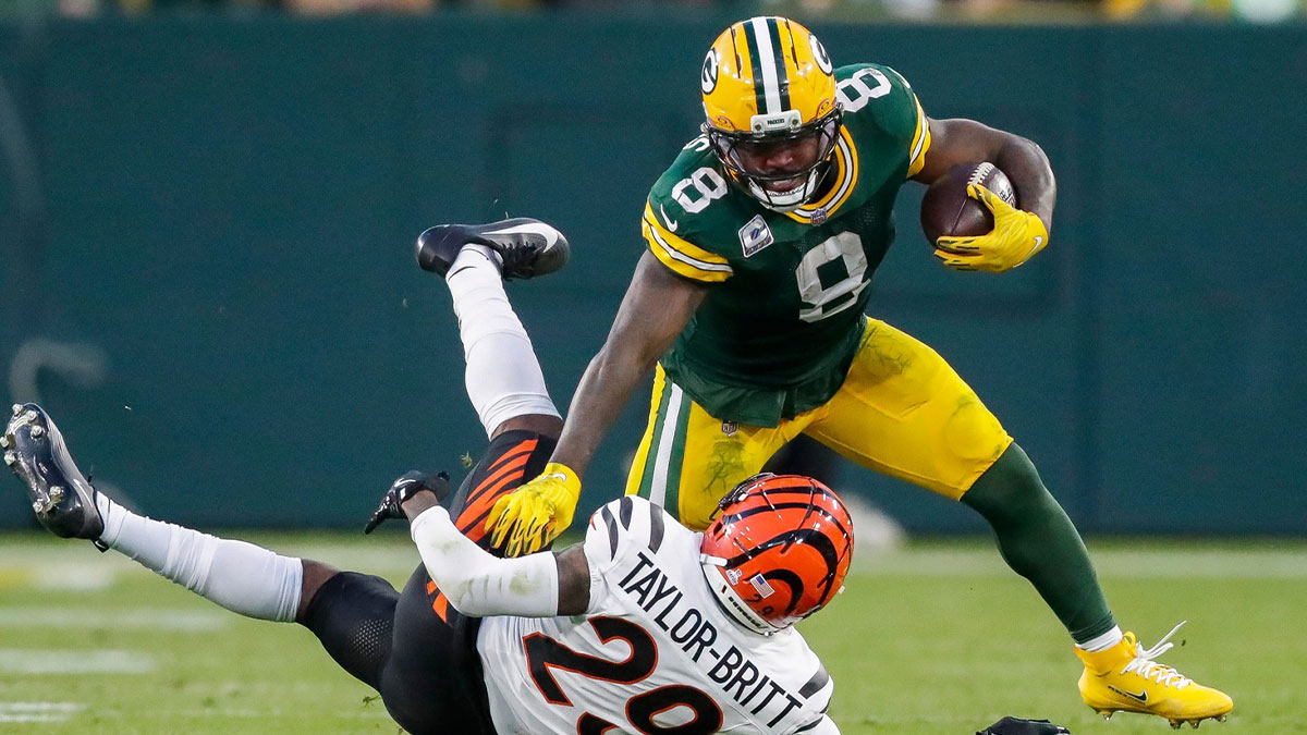 Green Bay Packers running back Josh Jacobs (8) stiff-arms Cincinnati Bengals cornerback Cam Taylor-Britt (29) on Sunday, October 12, 2025, at Lambeau Field in Green Bay, Wis. The Packers won the game, 27-18.