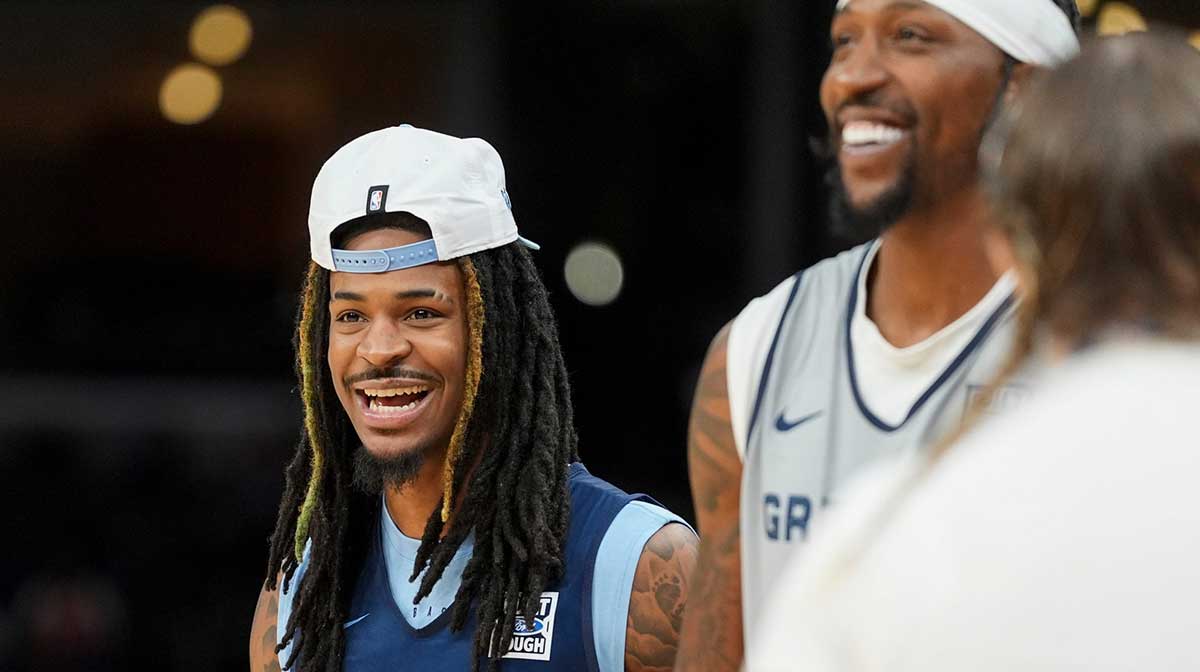 Grizzlies' Ja Morant (12) and Kentavious Caldwell-Pope (3) laugh together during open practice at the FedExForum on October 4, 2025, in Memphis, Tenn.