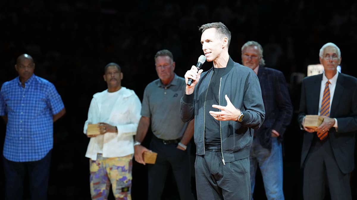 Suns legend Steve Nash greets fans during a Ring of Honor half time ceremony of the game against the Utah Jazz at Footprint Center with Thunder All-Star Shai Gilgeous-Alexander in the background