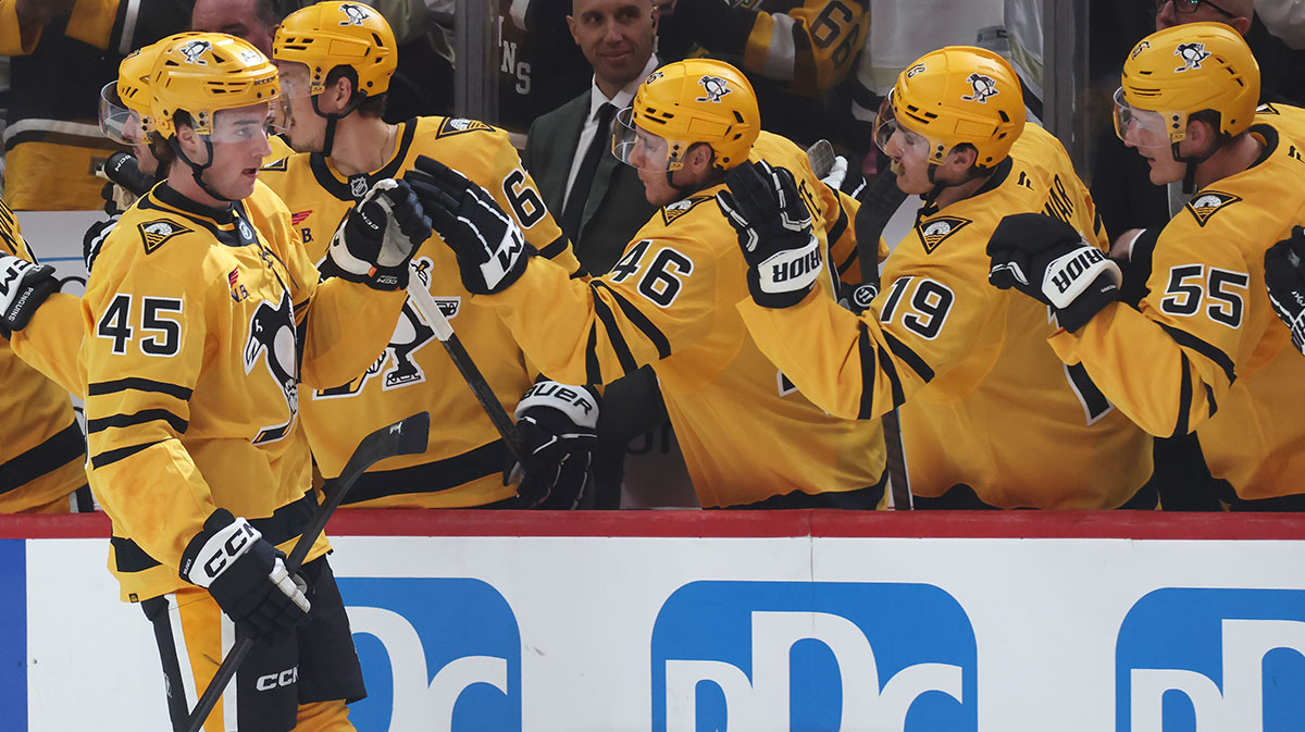 Pittsburgh Penguins defenseman Harrison Brunicke (45) celebrates his first NHL goal with the Penguins bench against the New York Islanders during the second period at PPG Paints Arena.