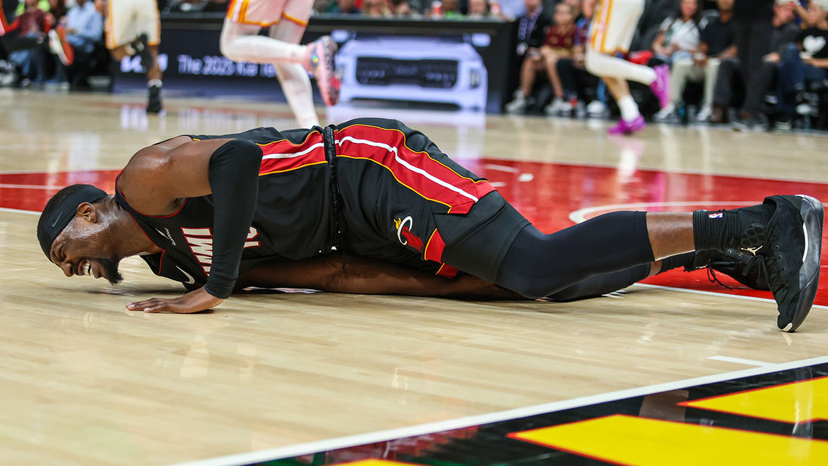 Heat center/forward Bam Adebayo (13) falls