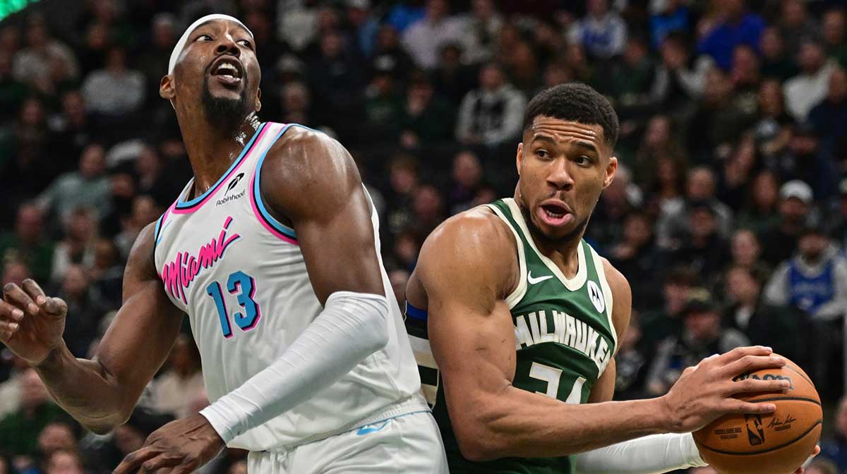 Bucks forward Giannis Antetokounmpo (34) looks for a shot against Miami Heat center Bam Adebayo (13) in the second quarter at Fiserv Forum