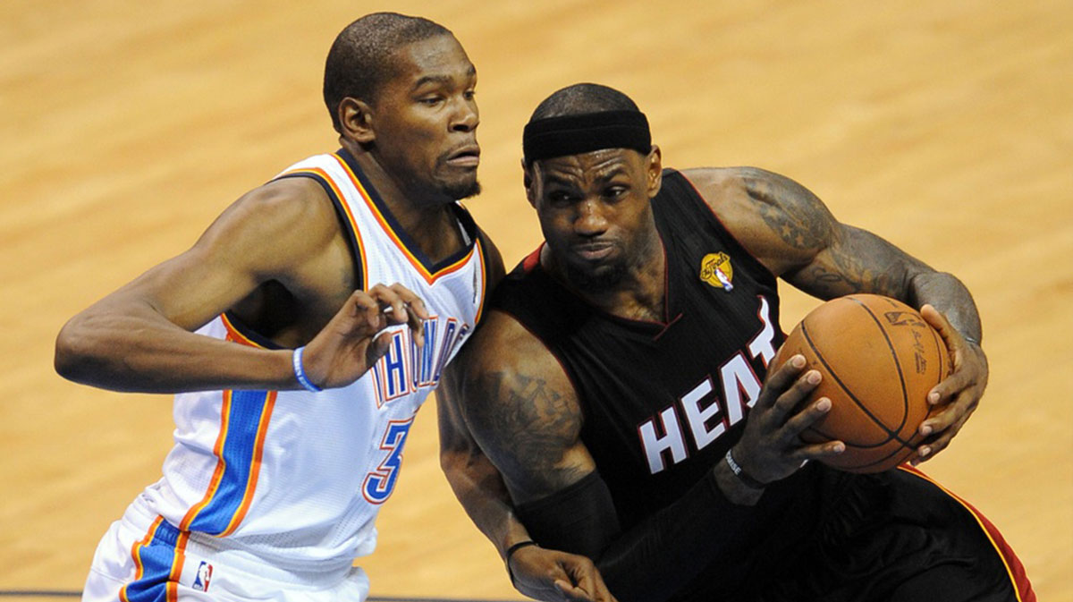 Heat small forward LeBron James (6) drives against Oklahoma City Thunder small forward Kevin Durant (35) during the third quarter of game two in the 2012 NBA Finals at the Chesapeake Energy Arena with Dwyane Wade in the background
