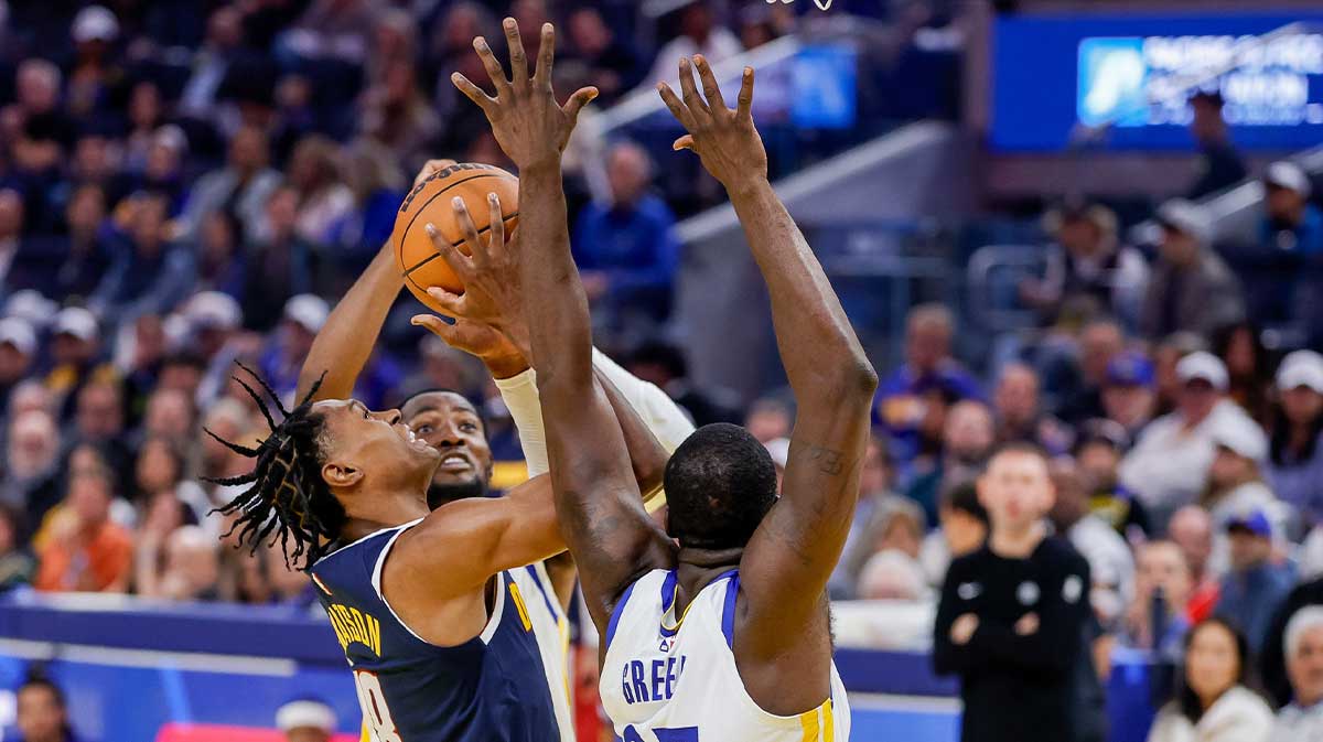 Denver Nuggets guard Peyton Watson (8) has a shot blocked by Golden State Warriors forward Draymond Green (23) during the second quarter at Chase Center.