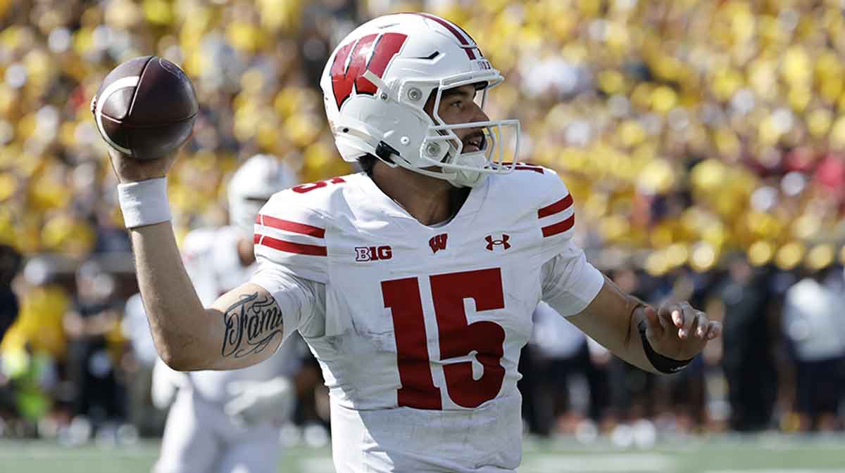 Wisconsin Badgers quarterback Hunter Simmons (15) passes in the second half against the Michigan Wolverines at Michigan Stadium.