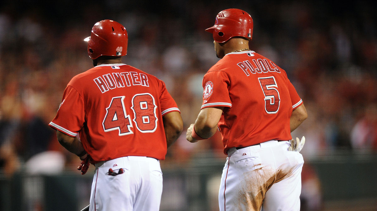 Los Angeles Angels first baseman Albert Pujols (5) and Los Angeles Angels right fielder Torii Hunter (48) run back to the dug out after scoring runs against the Baltimore Orioles during the fourth inning at Angel Stadium of Anaheim.