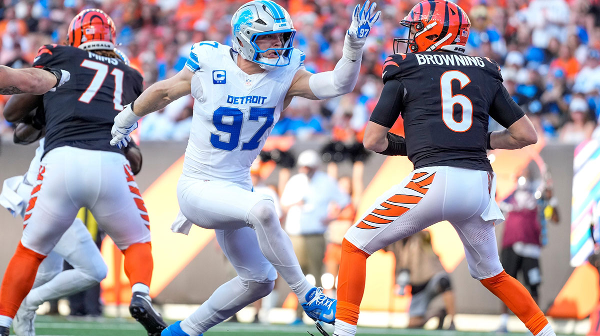 Detroit Lions defensive end Aidan Hutchinson (97) catches up to Cincinnati Bengals quarterback Jake Browning (6) in the end zone before pulling him down in the second quarter of the NFL Week 5 game between the Cincinnati Bengals and the Detroit Lions at Paycor Stadium in downtown Cincinnati on Sunday, Oct. 5, 2025.