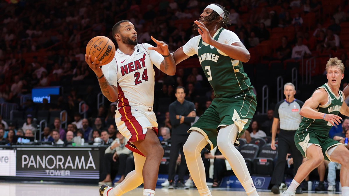 Miami Heat guard Norman Powell (24) drives to the basket against Milwaukee Bucks center Myles Turner (3) during the second quarter at Kaseya Center.