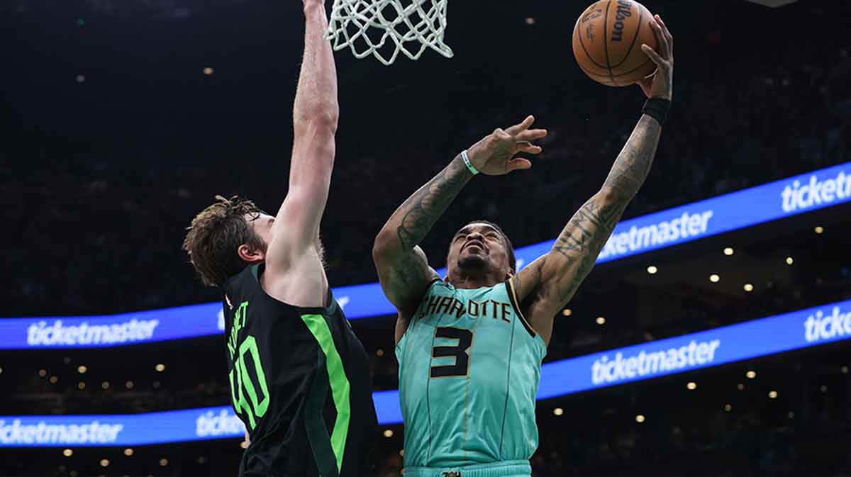Charlotte Hornets guard DaQuan Jeffries (3) shoots defended by Boston Celtics center Luke Kornet (40) during the second half at TD Garden.