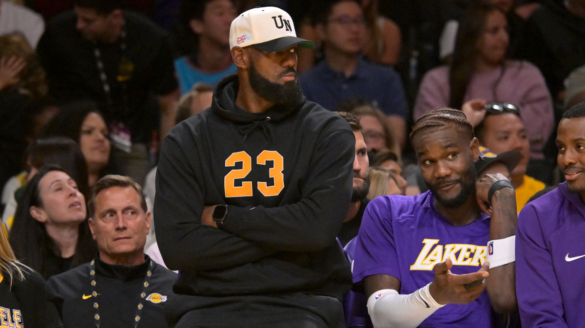 Los Angeles Lakers forward Lebron James (23) looks on from the bench during the first half against the Golden State Warriors at Crypto.com Arena.
