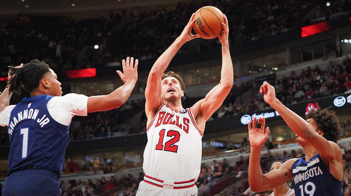 Minnesota Timberwolves guard/forward Terrence Shannon Jr. (1) defends Chicago Bulls forward/center Zach Collins (12) during the second half at United Center.