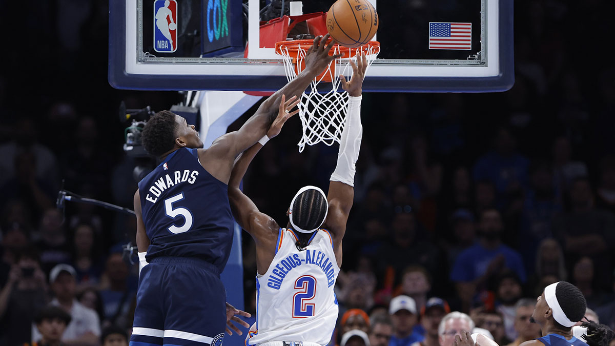 Minnesota Timberwolves guard Anthony Edwards (5) blocks a shot by Oklahoma City Thunder guard Shai Gilgeous-Alexander (2) during the second half at Paycom Center.