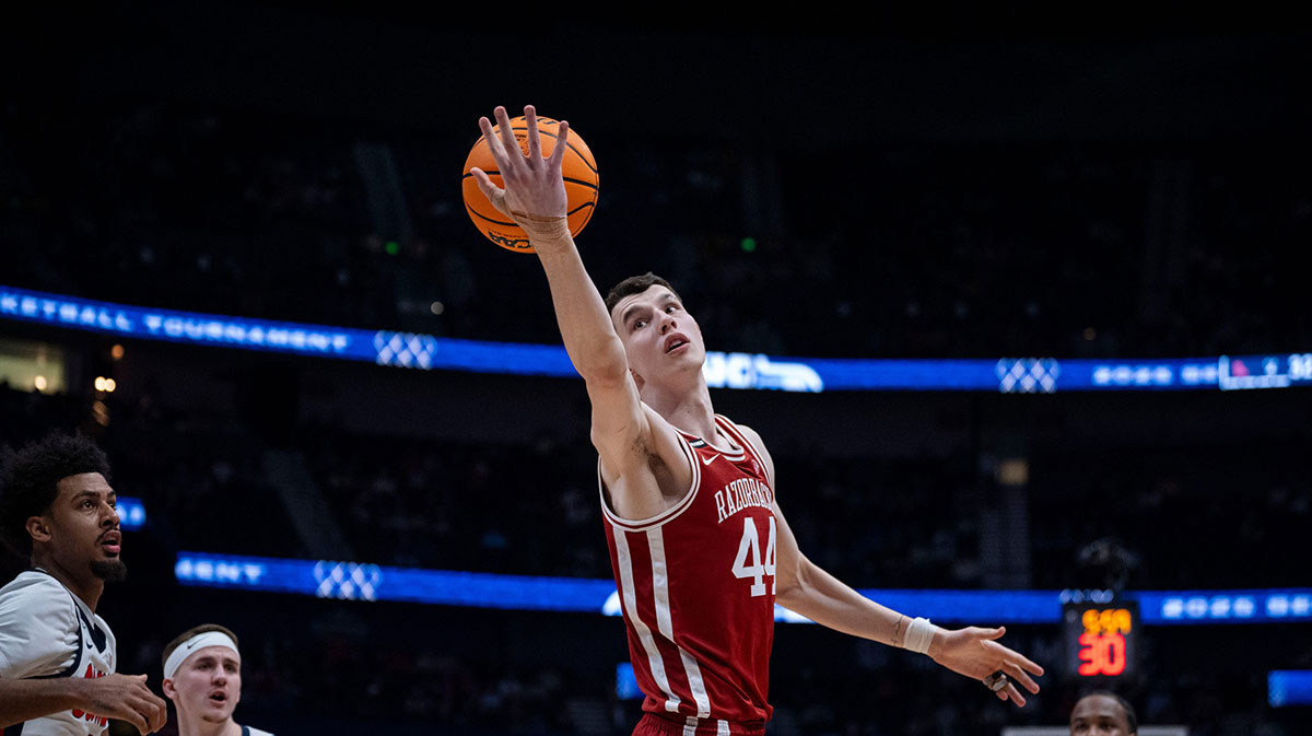 Arkansas Razorbacks forward Zvonimir Ivisic (44) comes down with a rebound during their second round game of the SEC Men's Basketball Tournament at Bridgestone Arena in Nashville, Tenn., Thursday, March 13, 2025.