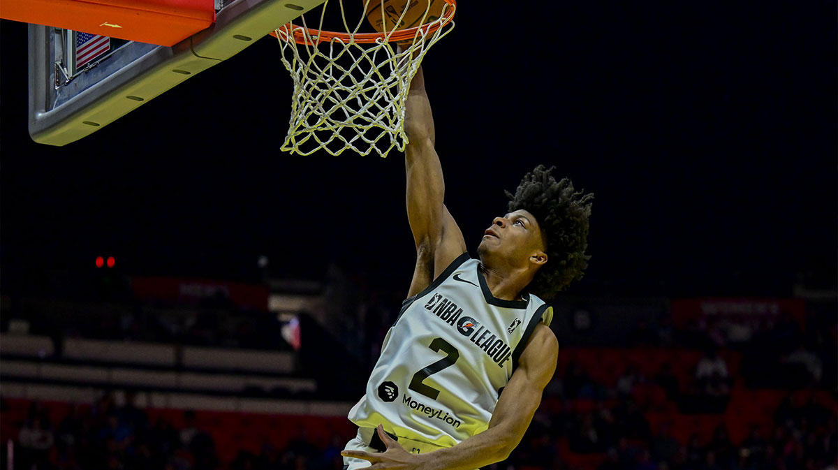 Team Scoot guard London Johnson (2) makes a slam dunk against Team Luka during the second half at the Jon M. Huntsman Center.