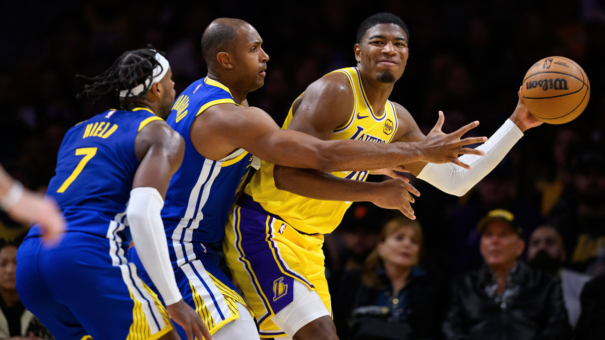Los Angeles Lakers forward Rui Hachimura (28) passes against Golden State Warriors center Al Horford (20) and guard Buddy Hield (7) during the second half at Crypto.com Arena.