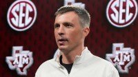 Texas A&M head coach Bucky McMillan speaks at SEC Media Day in the Grand Bohemian Hotel.