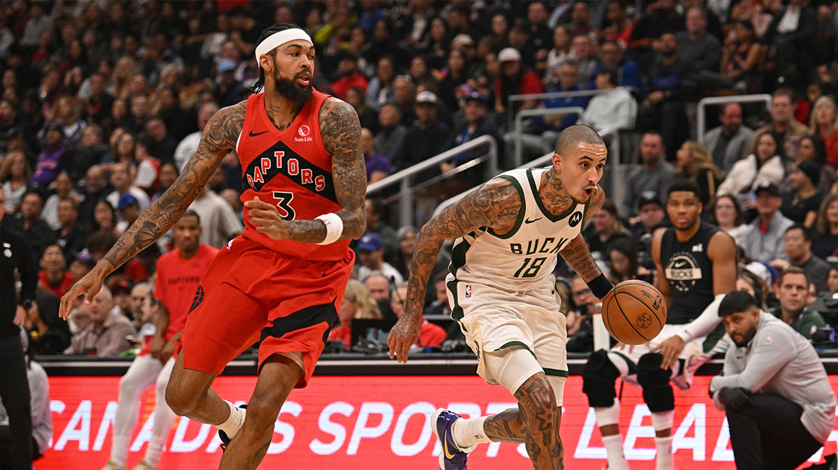 Milwaukee Bucks forward Kyle Kuzma (18) dribbles past Toronto Raptors forward Brandon Ingram (3) in the second quarter at Scotiabank Arena.