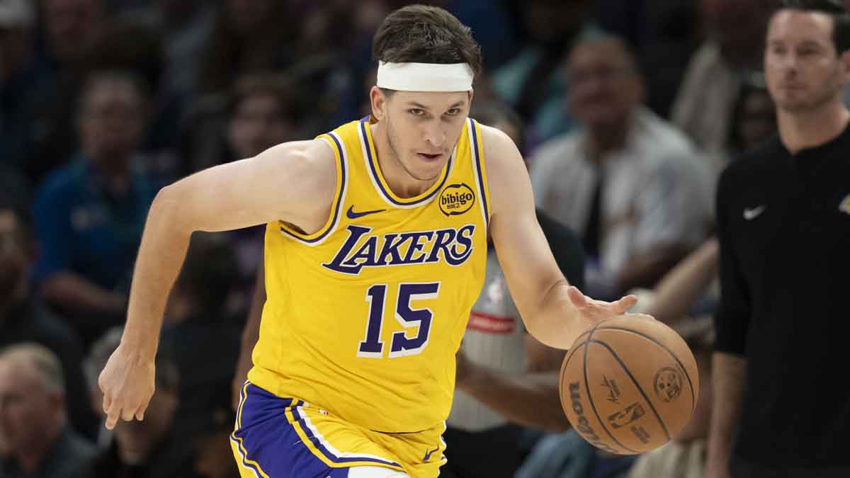Los Angeles Lakers guard Austin Reaves (15) dribbles the ball against the Minnesota Timberwolves in the second half at Target Center.