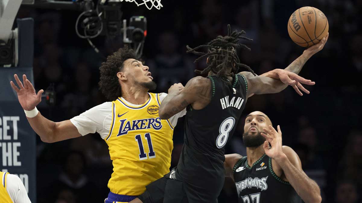 Minnesota Timberwolves guard Bones Hyland (8) drives to the basket as Los Angeles Lakers center Jaxson Hayes (11) plays defense in the second half at Target Center.