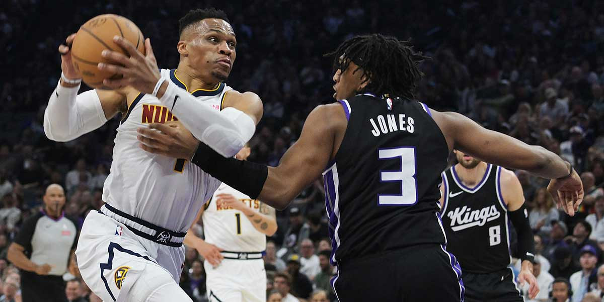 Denver Nuggets guard Russell Westbrook (4) drives to the basket against Sacramento Kings center Isaac Jones