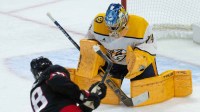 Ottawa Senators center Tim Stutzle (18) shoots on Nashville Predators goalie Juuse Saros (74) in the third period at the Canadian Tire Centre.